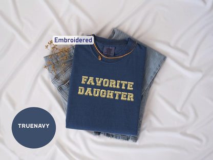 a t - shirt with the words favorite daughter printed on it