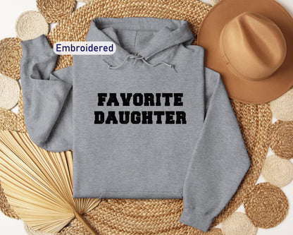 a gray hoodie with the words favorite daughter on it