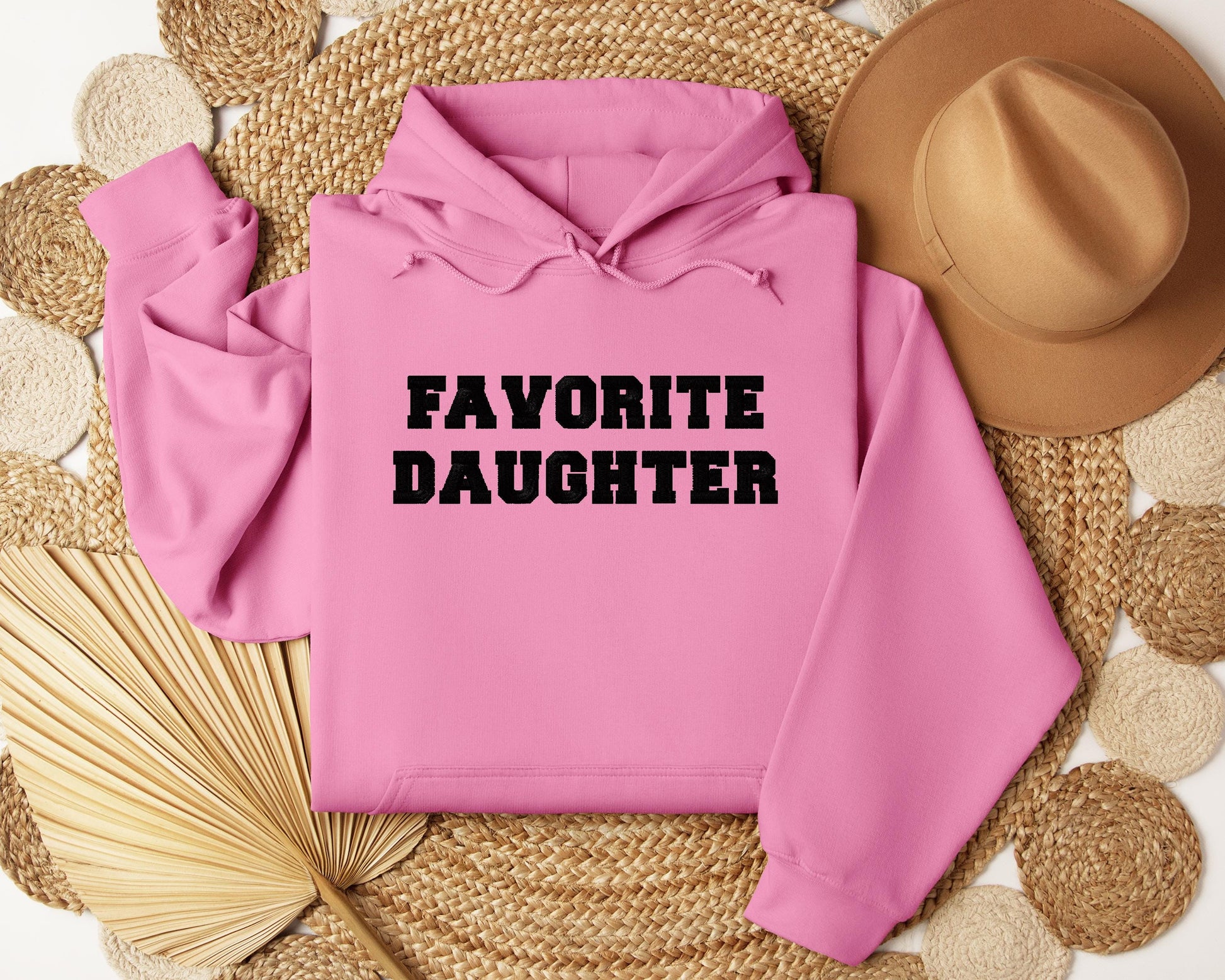 a pink hoodie with the words favorite daughter on it