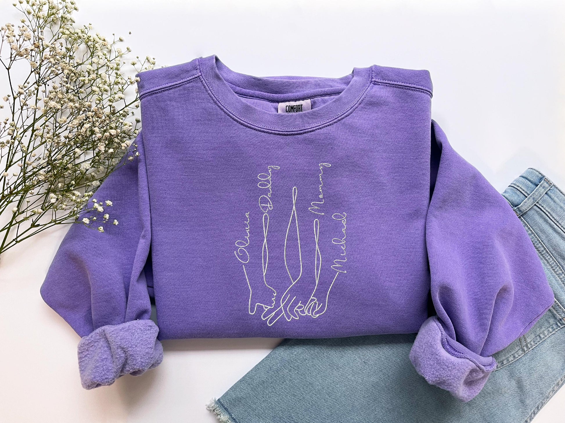 a purple shirt with a skeleton on it