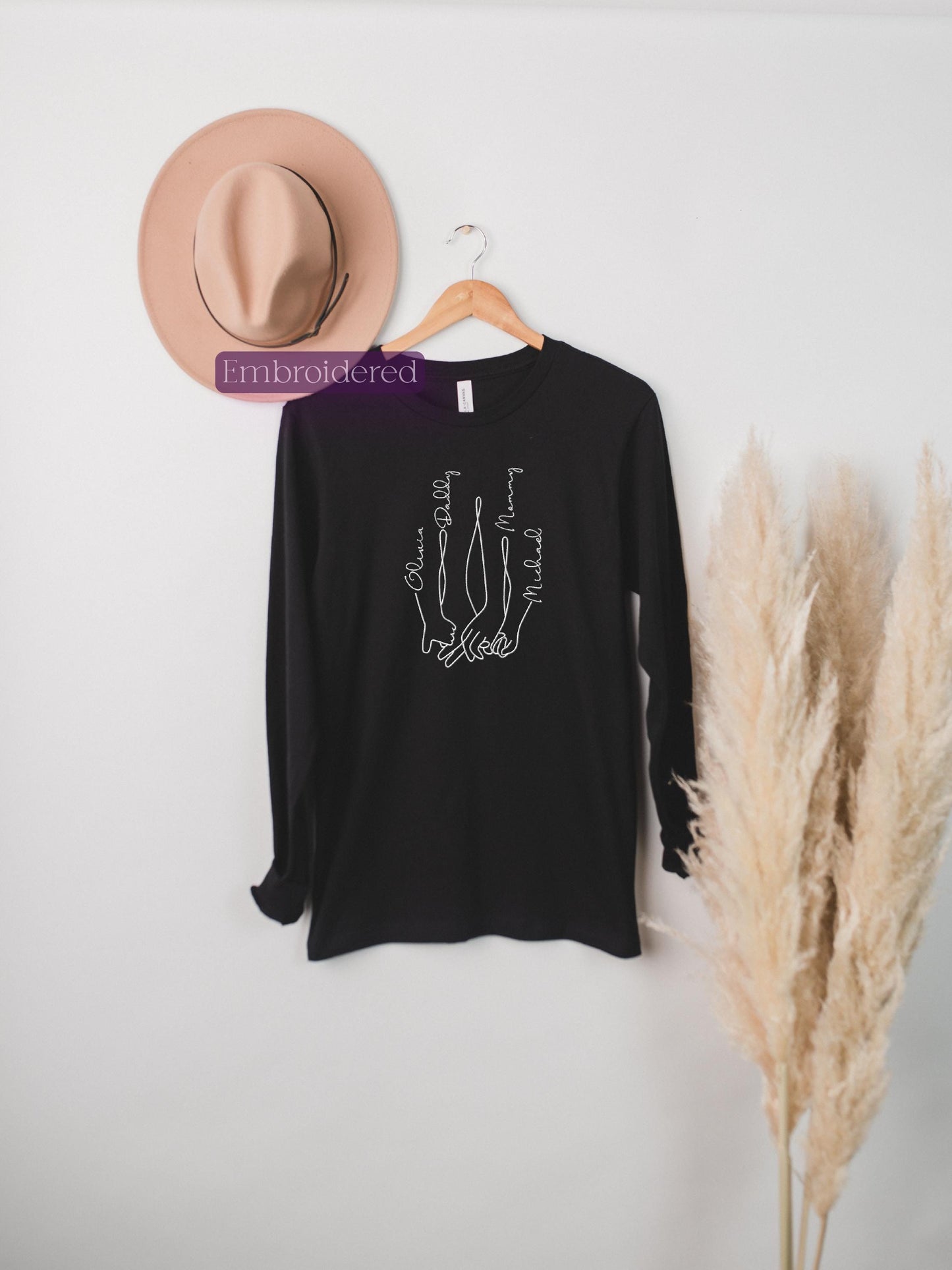 a hat and a t - shirt hanging on a wall