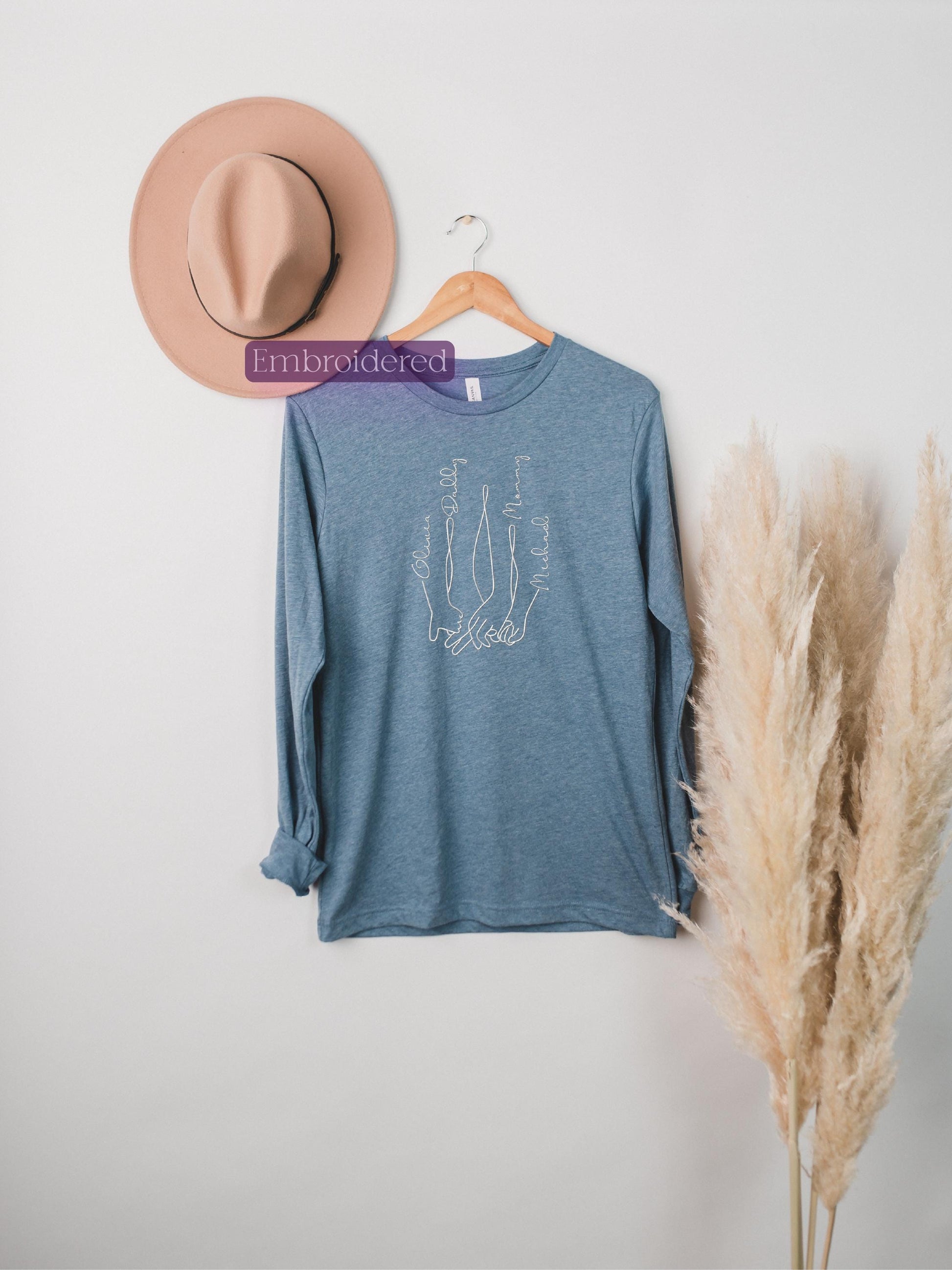 a hat and a t - shirt hanging on a wall