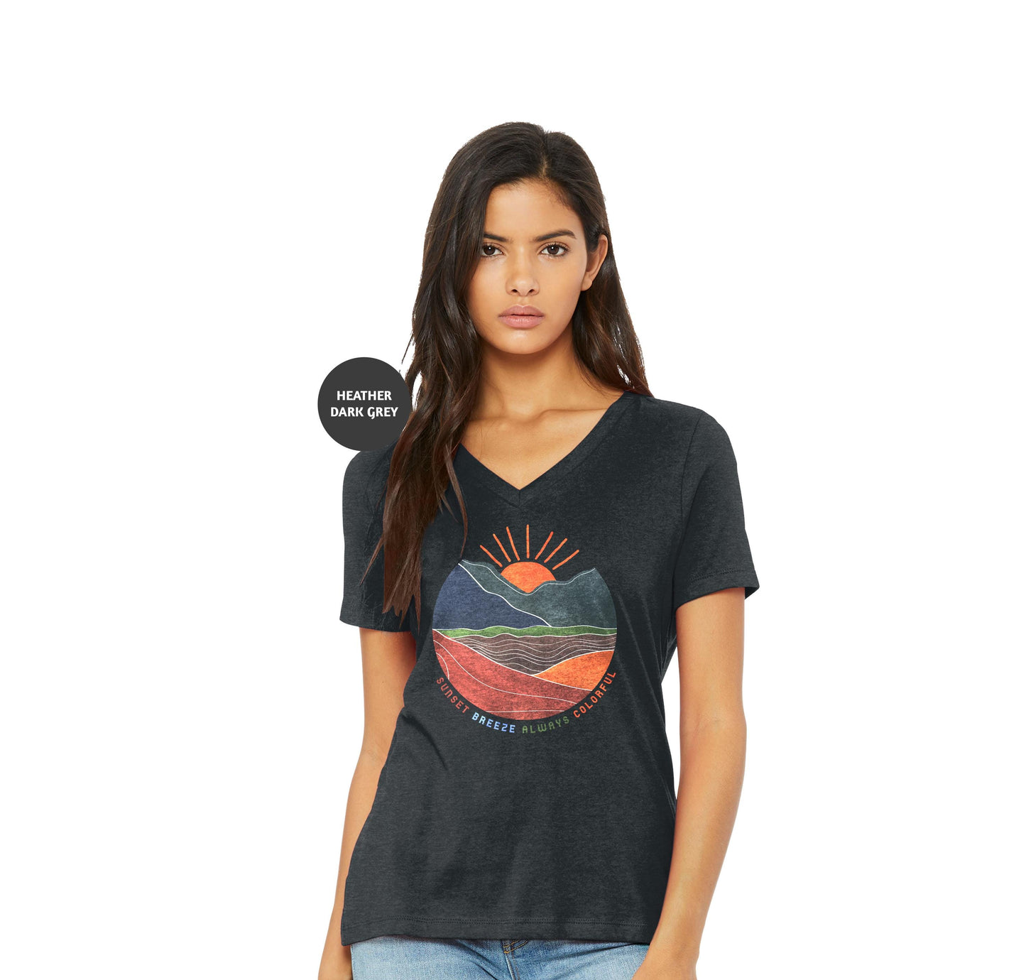 a woman wearing a black t - shirt with a sunset graphic on it