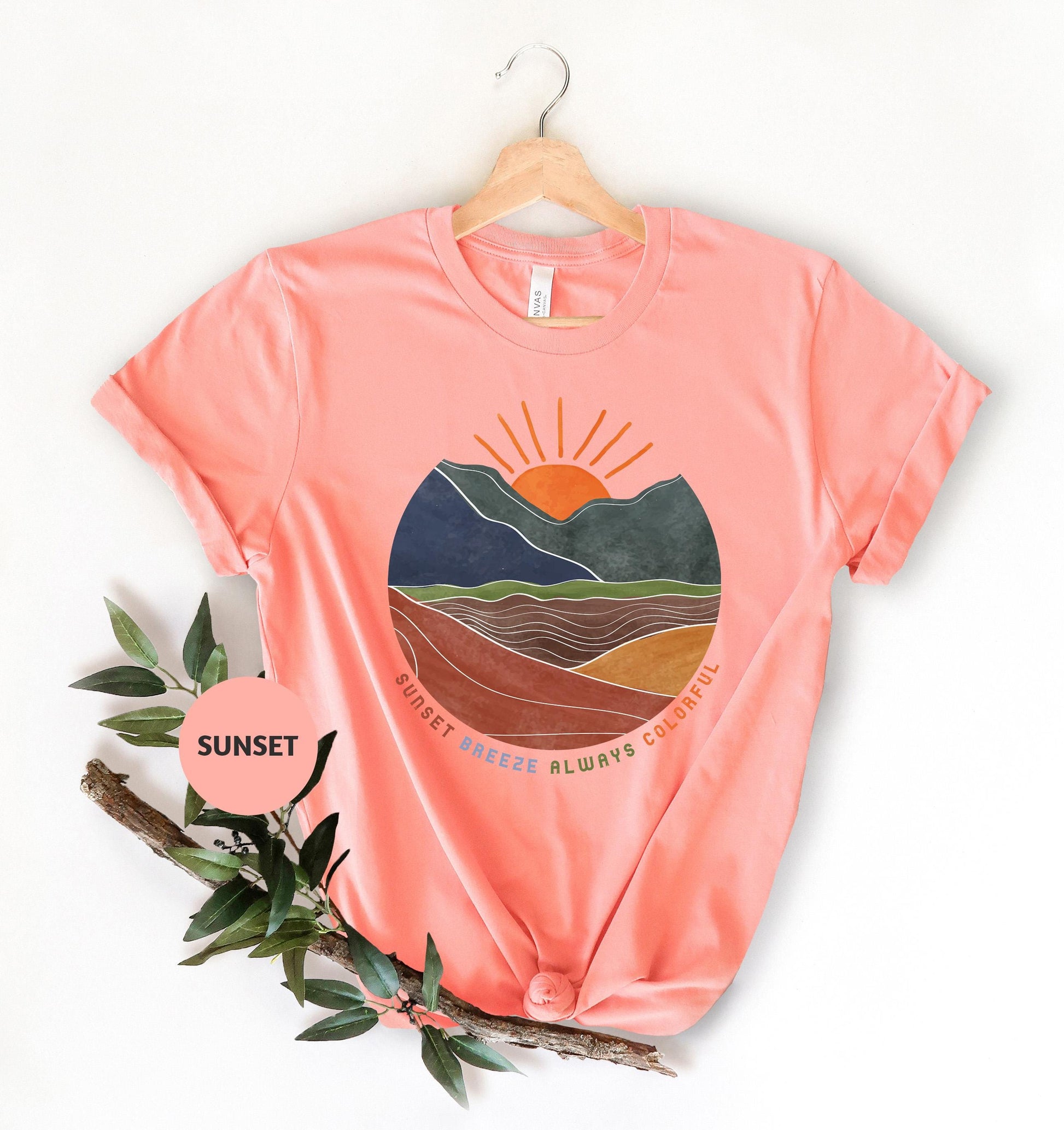 a t - shirt with a mountain scene on it
