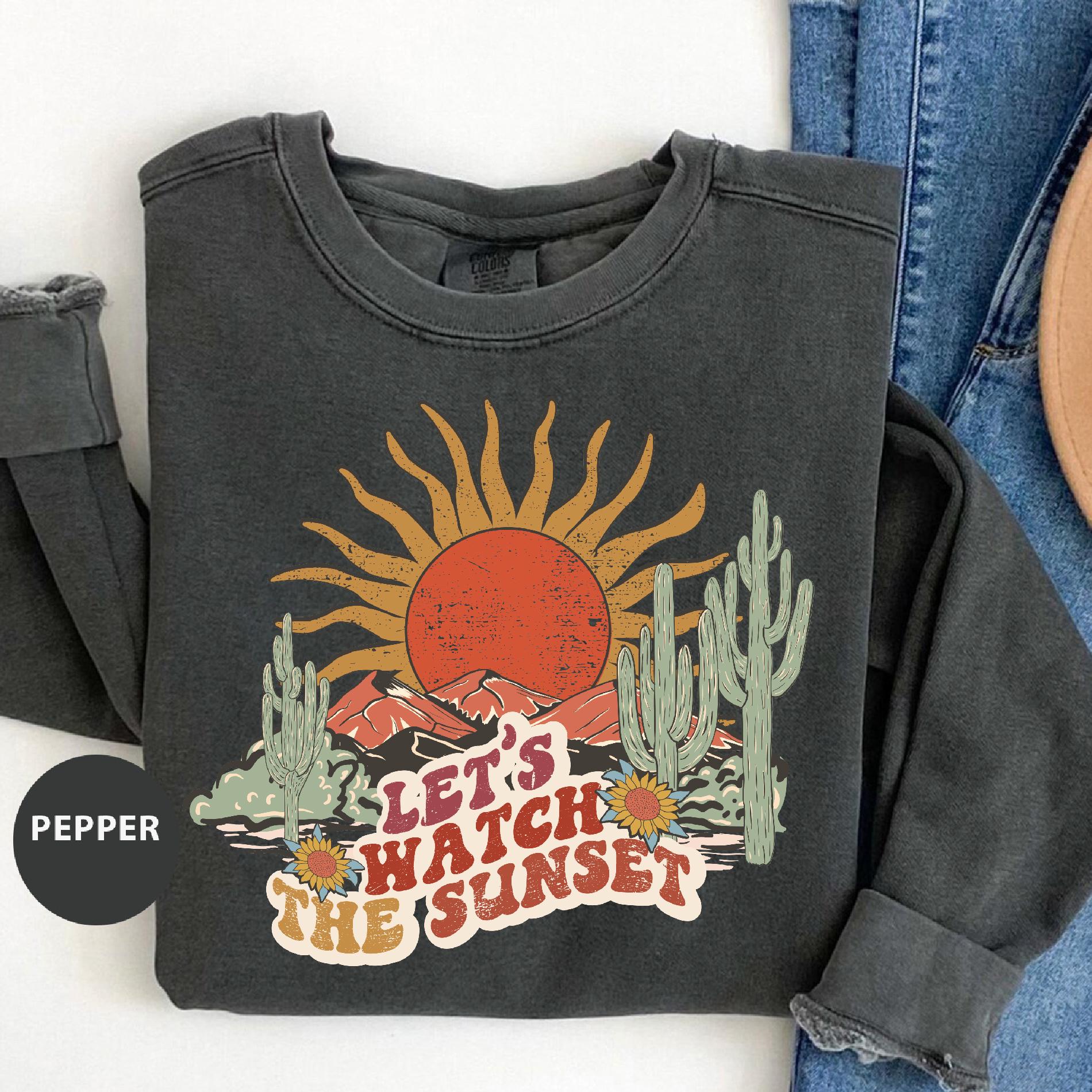 a pair of jeans and a t - shirt with the words let's watch