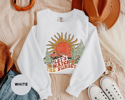 a white shirt with the words let's watch the sunset on it