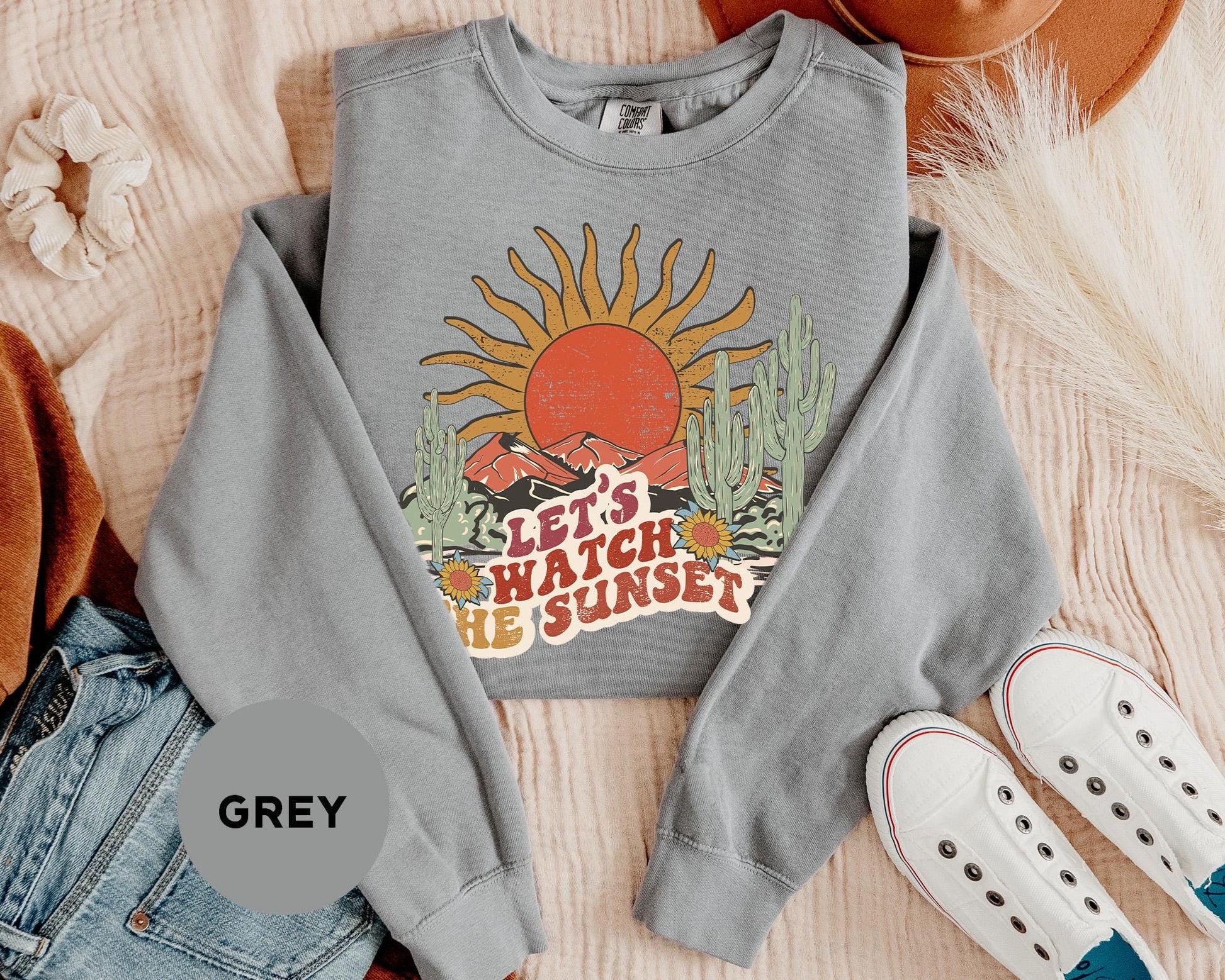 a sweatshirt with the words let's watch the sunset printed on it