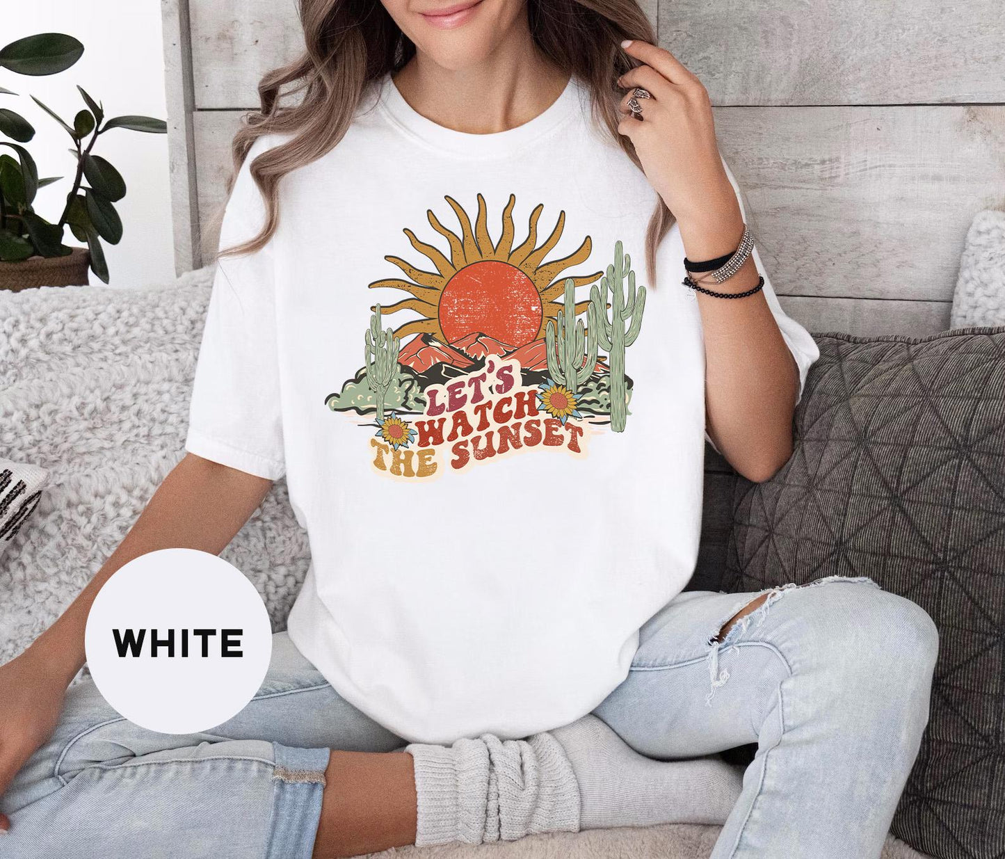 a woman sitting on a couch wearing a white shirt