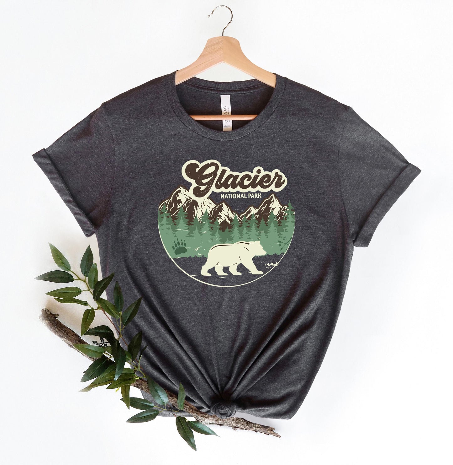 a black t - shirt with a bear on it