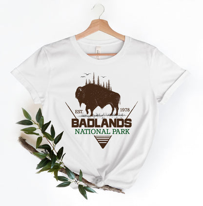 a white t - shirt with a buffalo and the words badlands national park on