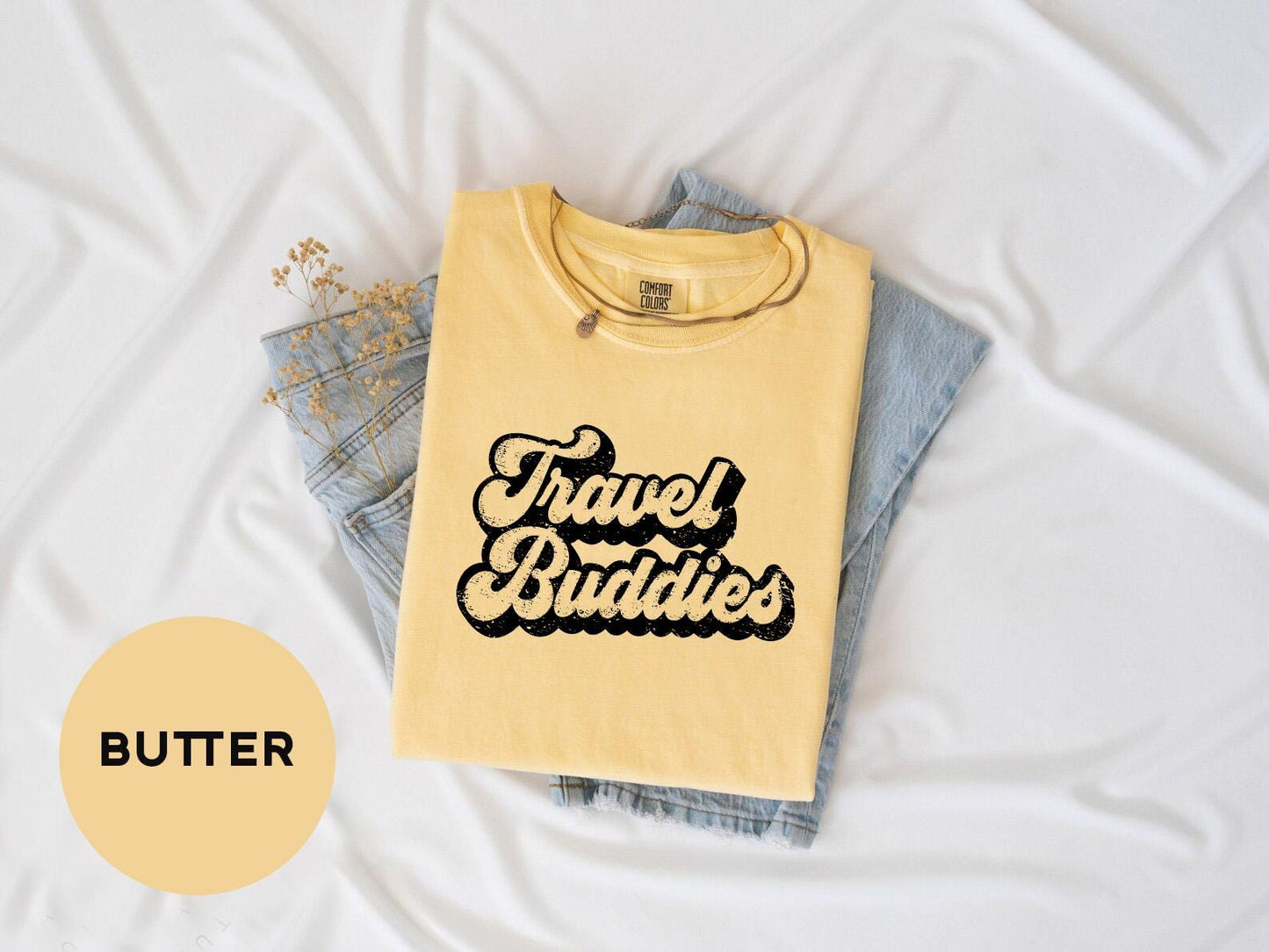 a yellow shirt that says travel buddies on it