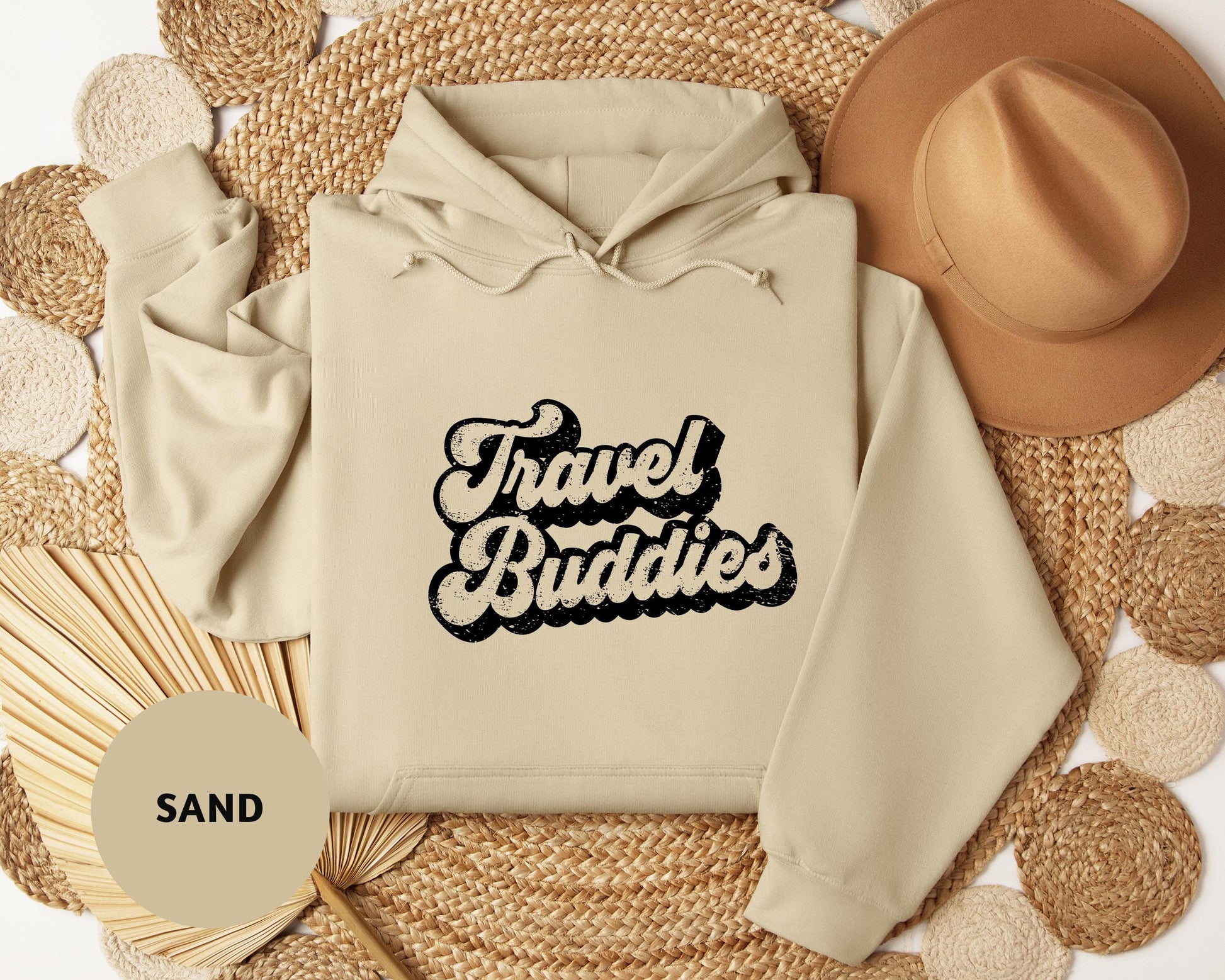 a white hoodie with the words travel buddies printed on it