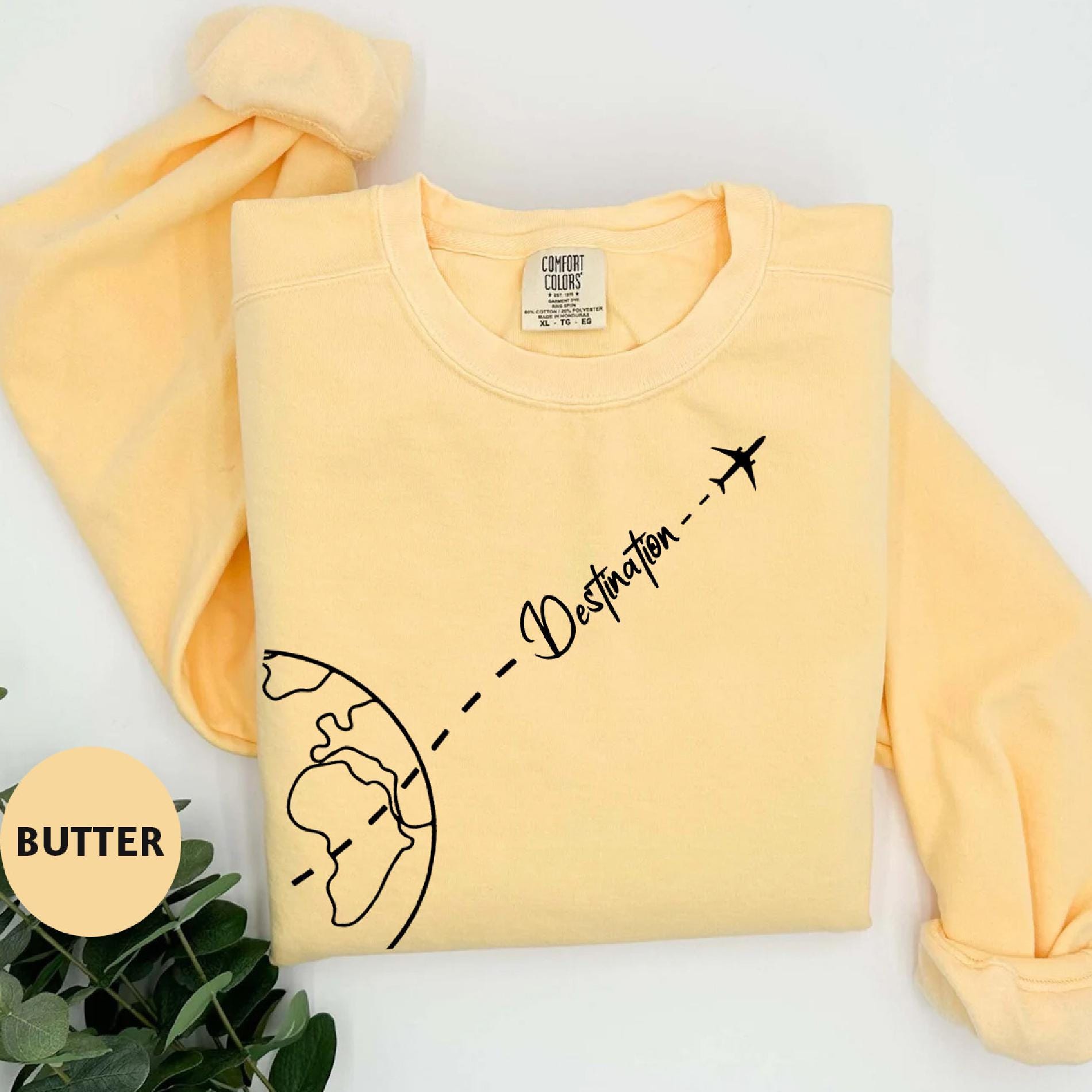a yellow shirt with a picture of a man and a woman on it