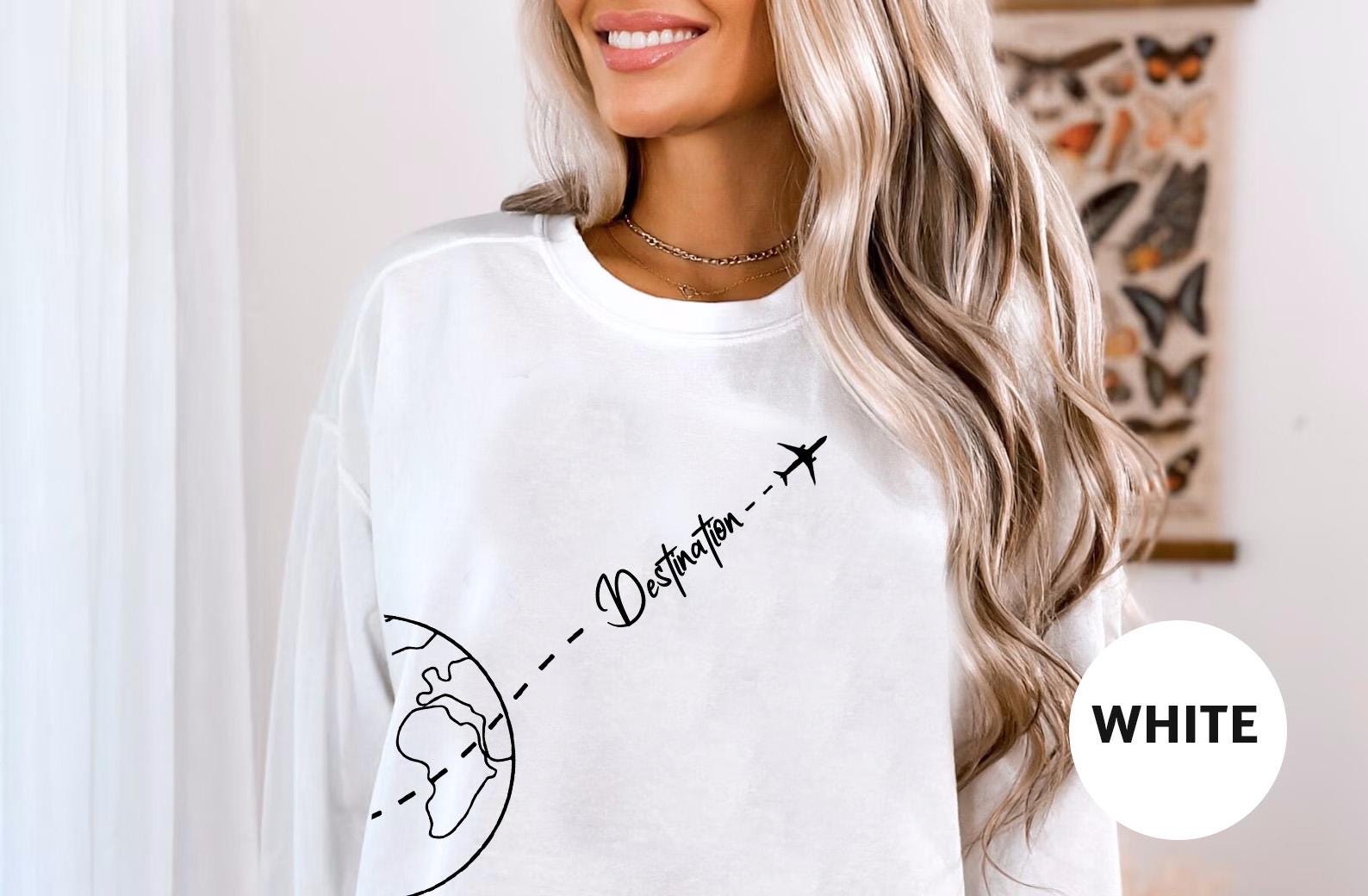 a woman with blonde hair wearing a white shirt