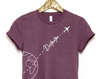 a t - shirt with a picture of the earth and a plane on it