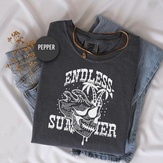 a t - shirt that says endless sunter on it next to a pair of