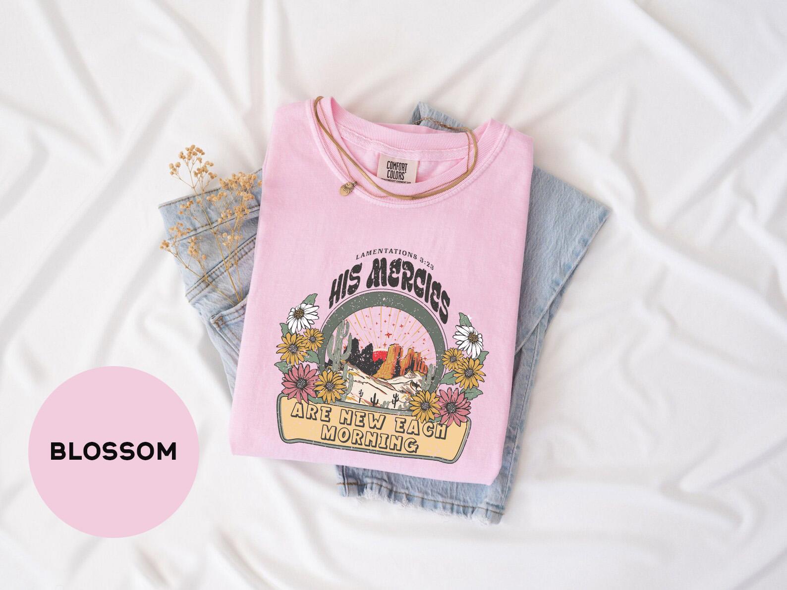a pink shirt with a picture of a dog on it