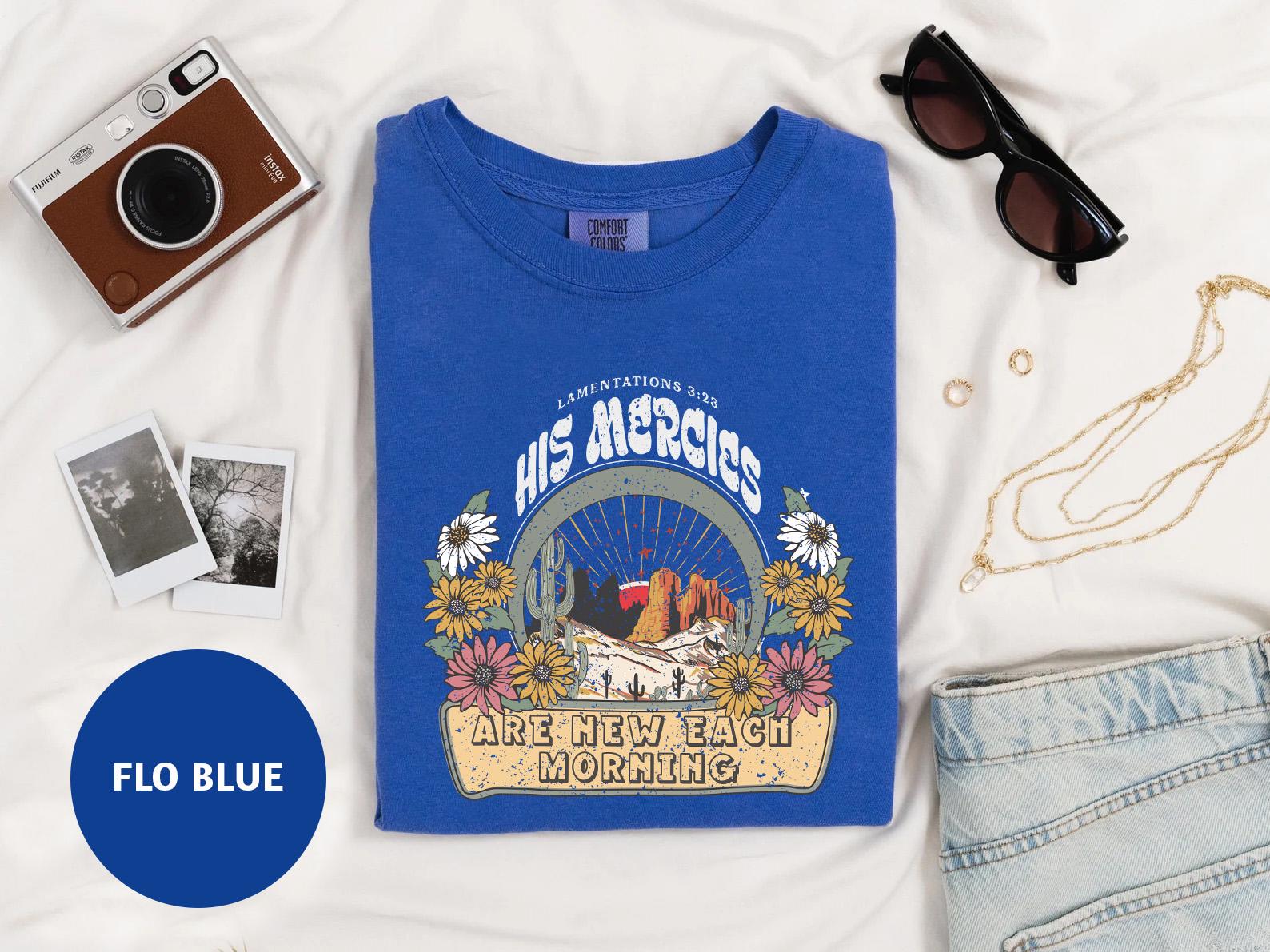 a blue t - shirt with a picture of an eagle on it