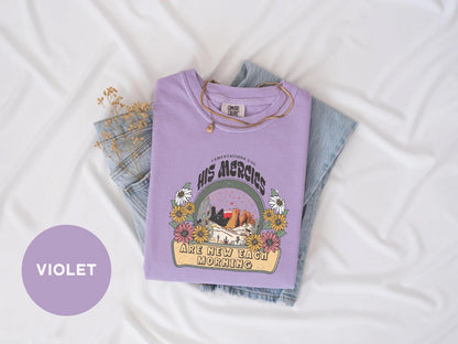 a purple shirt with a picture of a mountain and trees on it