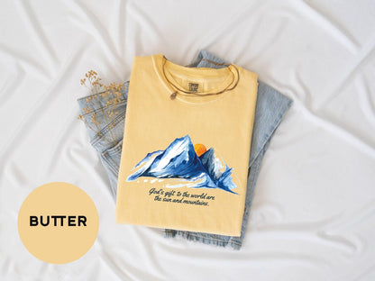 a yellow shirt with a picture of a mountain on it