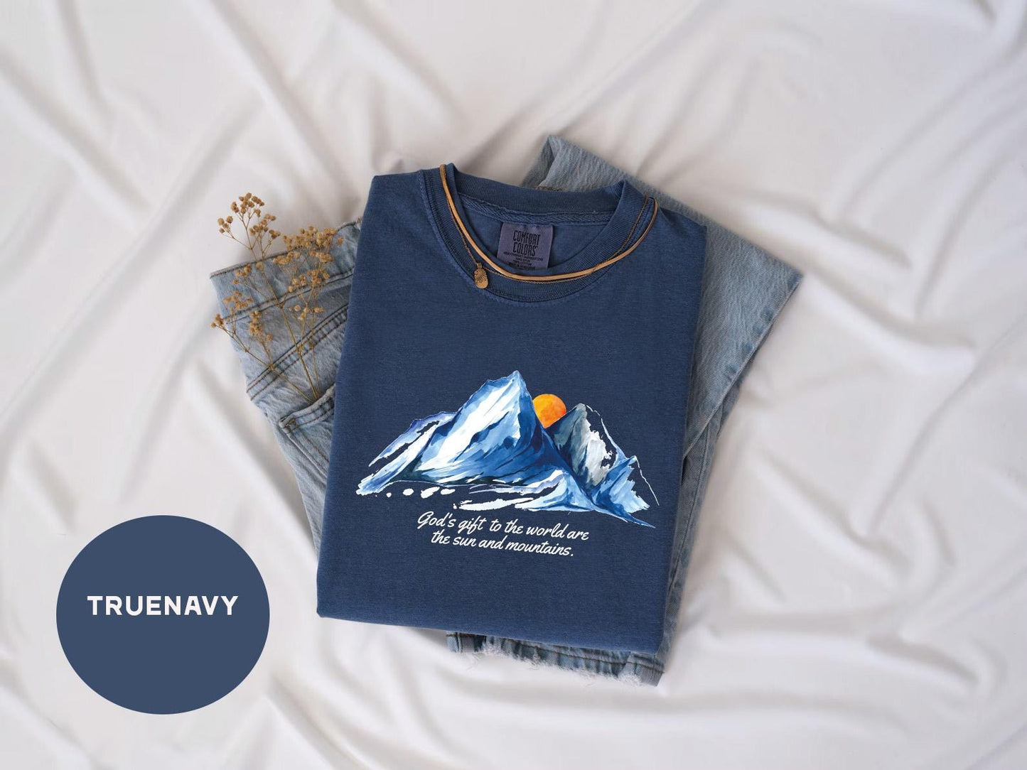 a t - shirt with a picture of a mountain on it