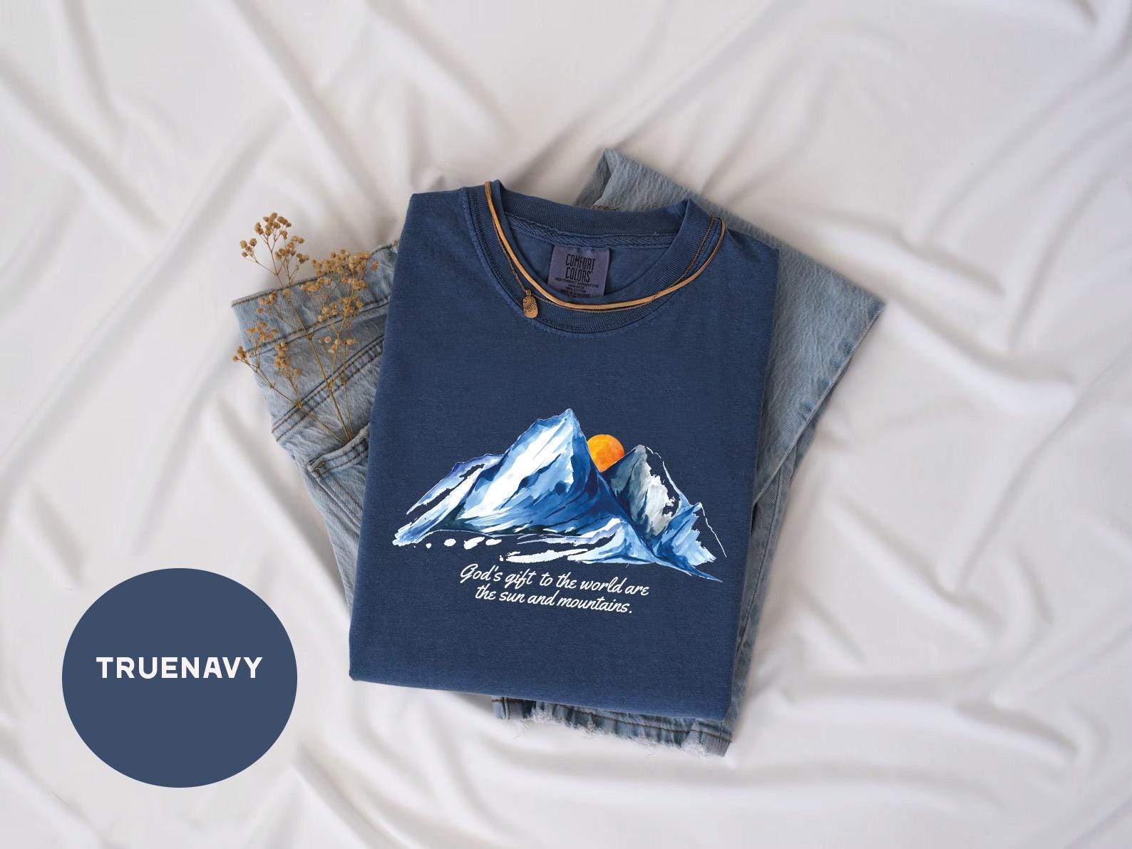 a t - shirt with a picture of a mountain on it