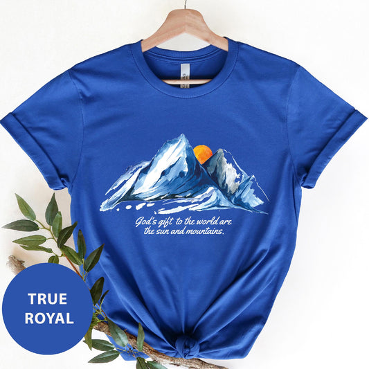 a blue t - shirt with a mountain scene on it