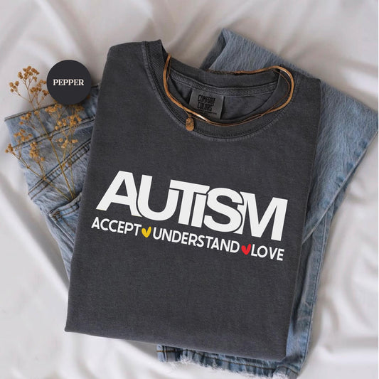 a pair of jeans and a t - shirt on a bed