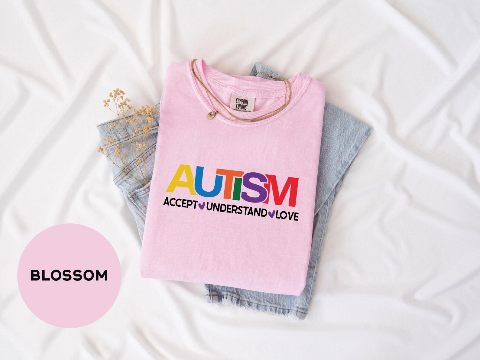 a pink shirt with the words autism on it