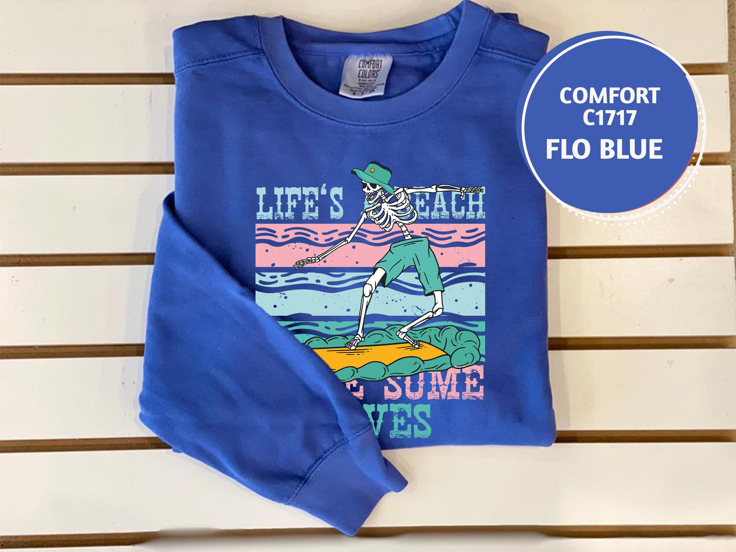 a blue shirt with a picture of a skeleton on it