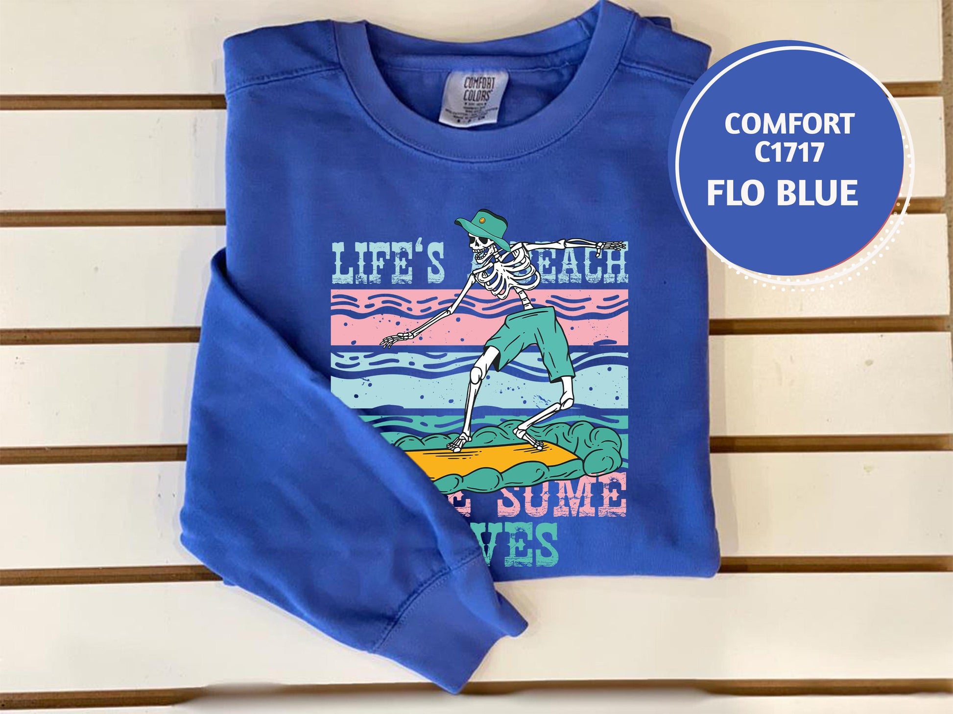 a blue shirt with a picture of a skeleton on it