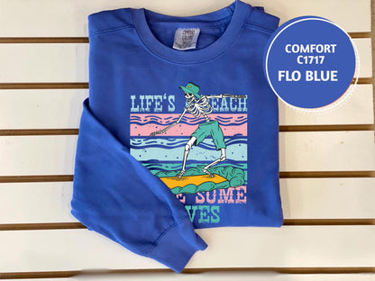 a blue shirt with a picture of a skeleton on it