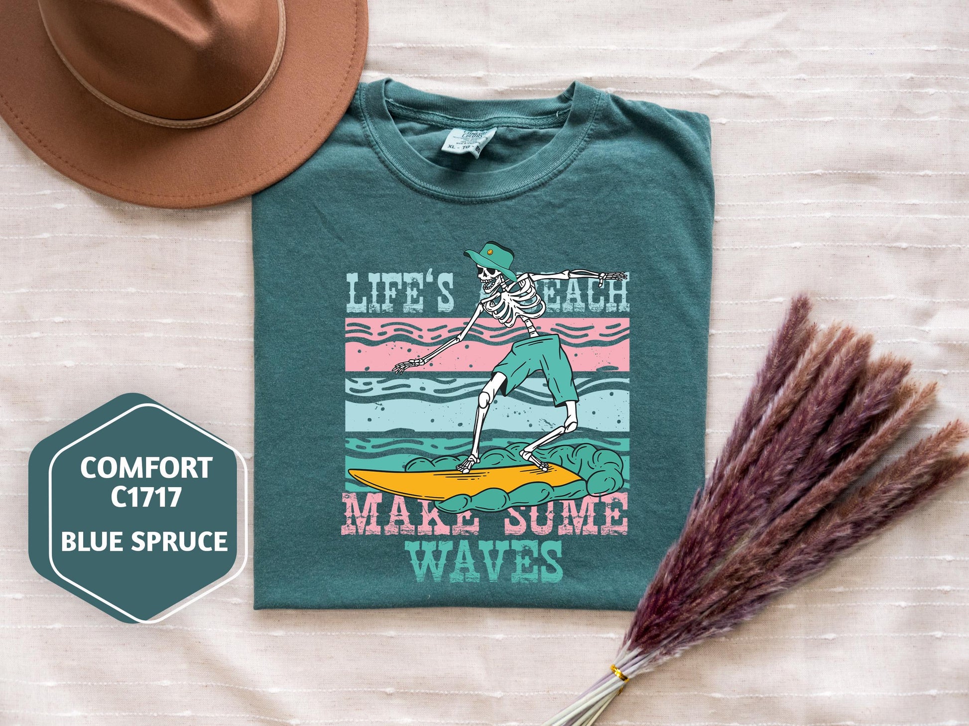 a t - shirt with a picture of a woman on a surfboard and a