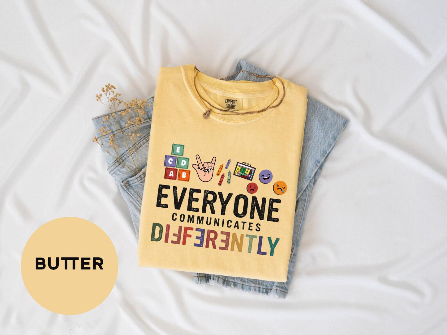 a t - shirt that says everyone communicate differently on it