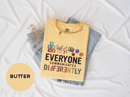 a t - shirt that says everyone communicate differently on it