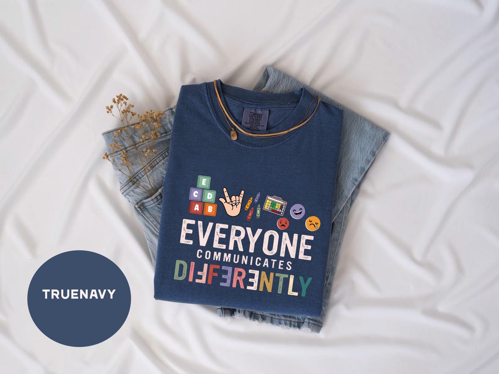 a t - shirt that says everyone communicate differently on it