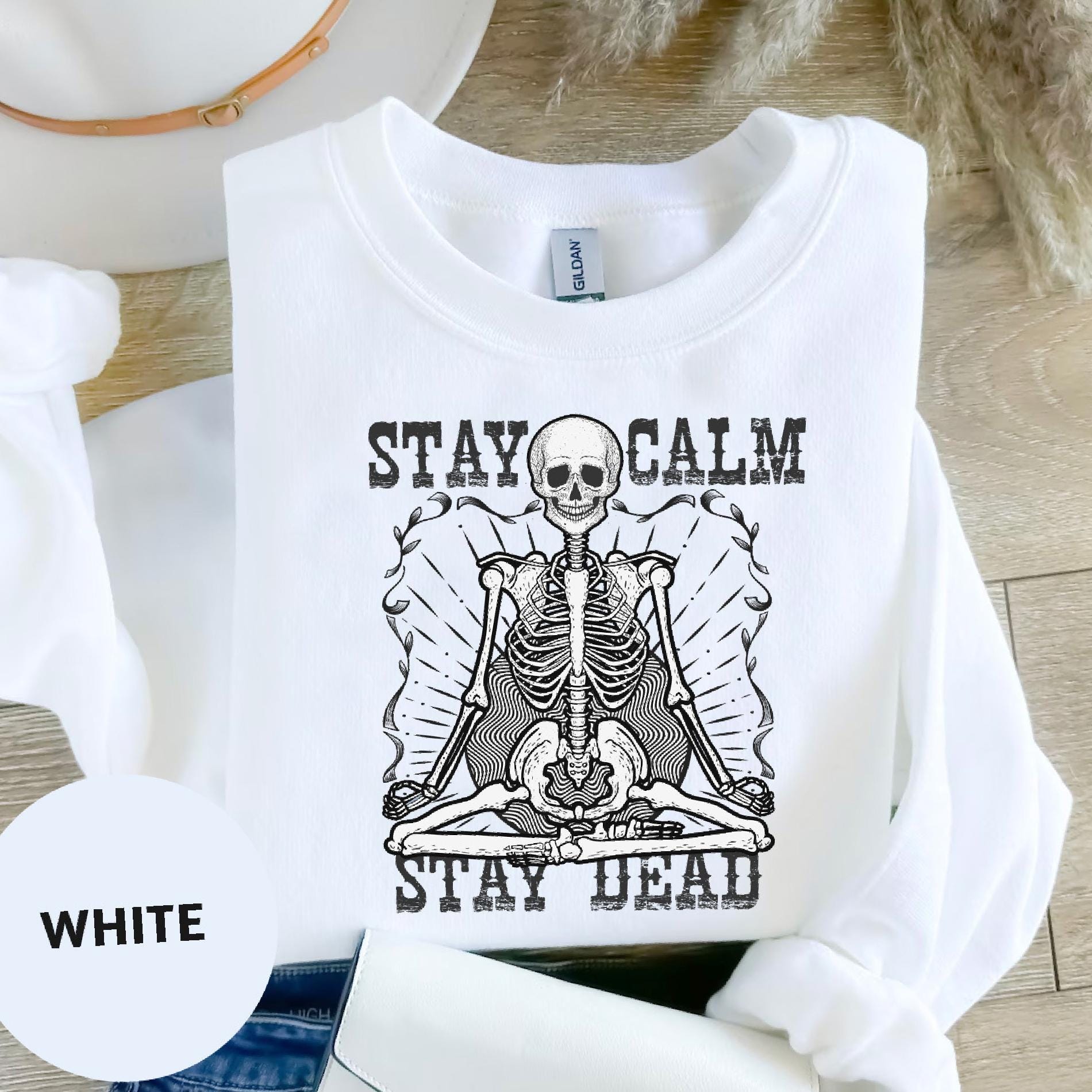 a white shirt with a skeleton on it