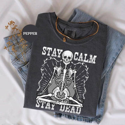 a t - shirt with a skeleton on it that says stay calm and stay dead