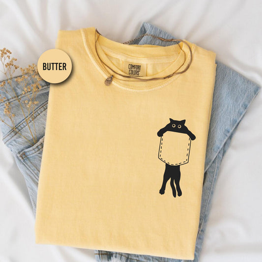 a yellow shirt with a picture of a giraffe on it