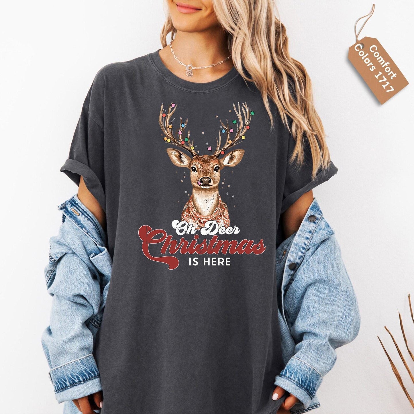 a woman wearing a t - shirt with a deer on it