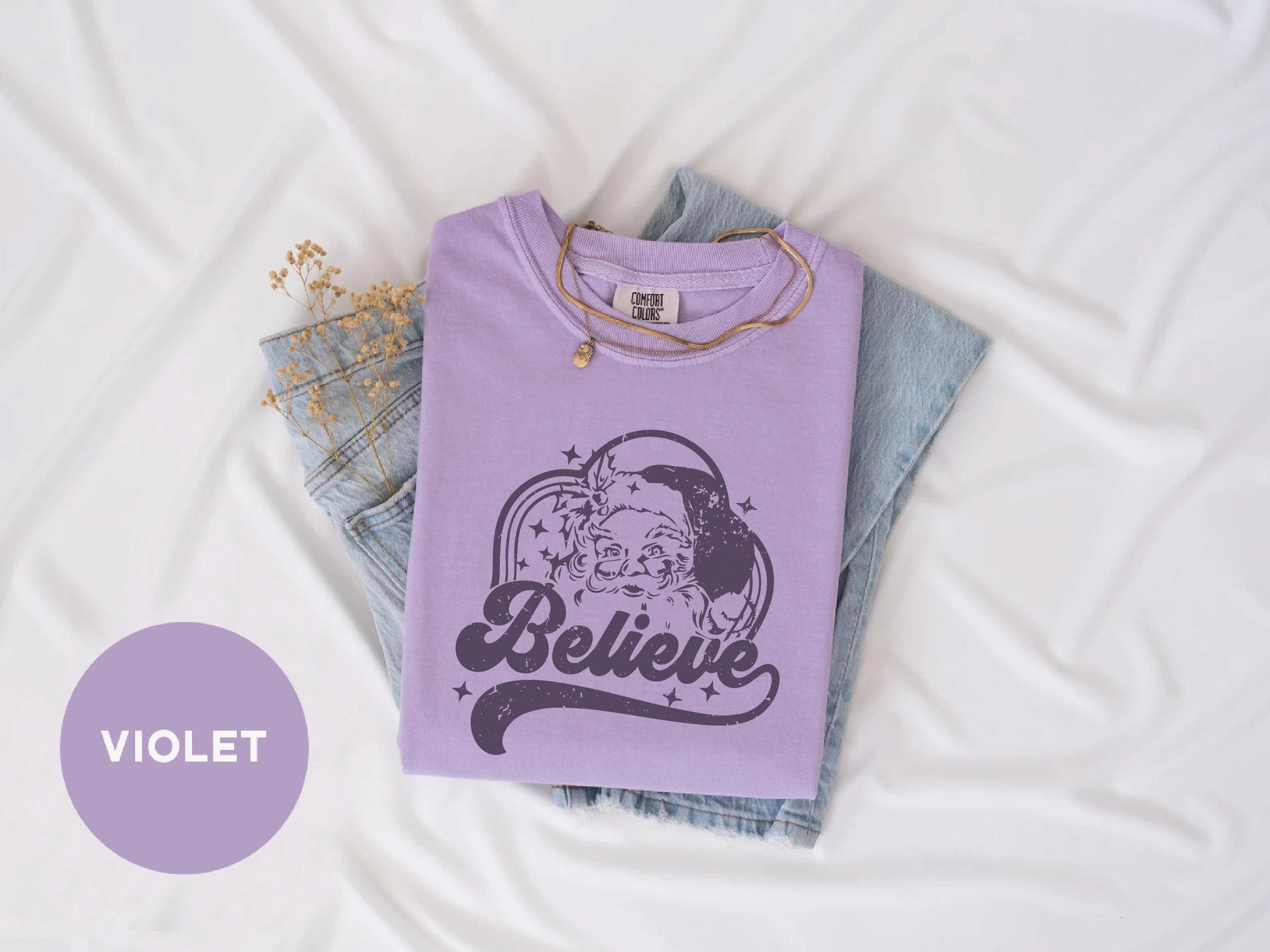 a t - shirt with the word believe printed on it