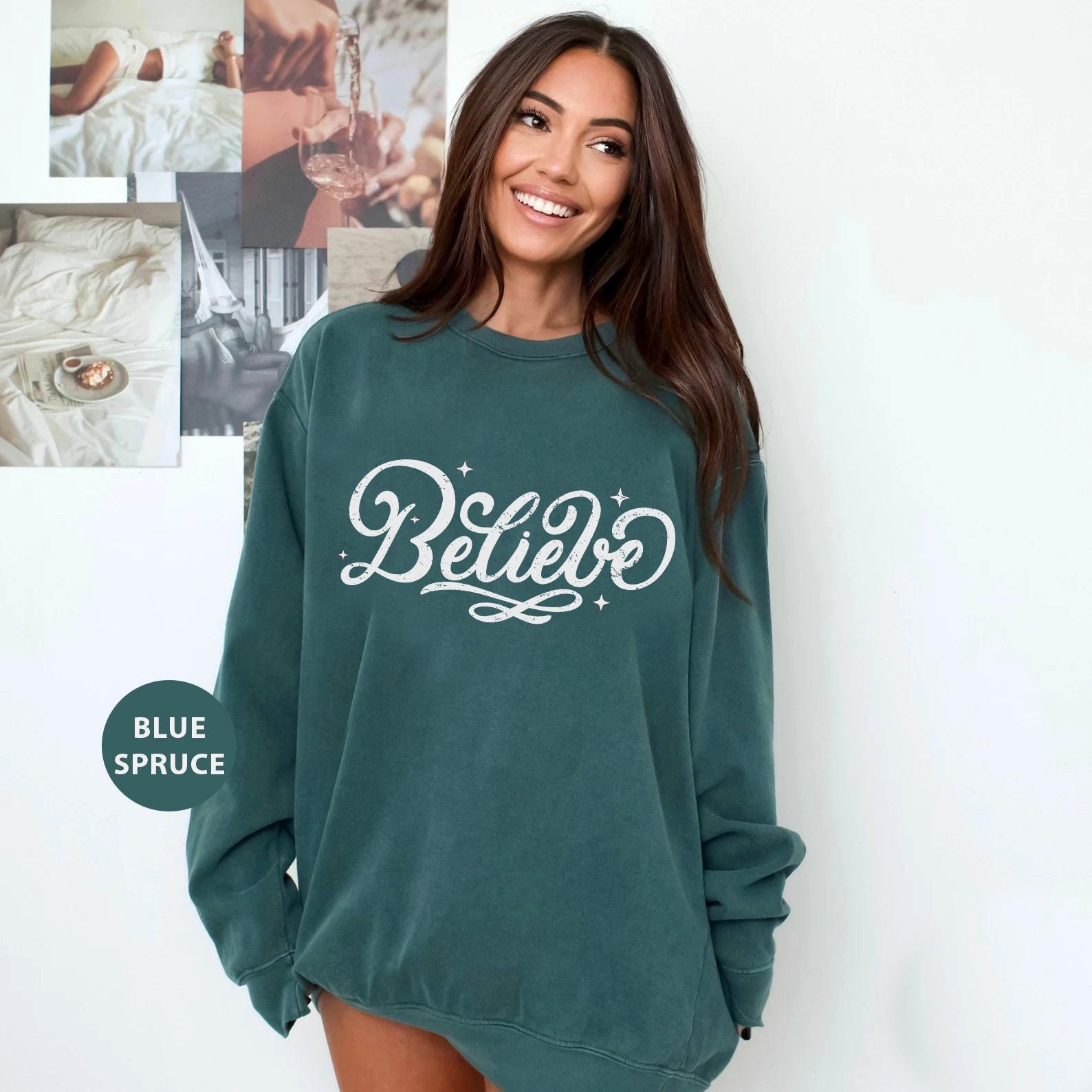 a woman in a green sweatshirt posing for a picture
