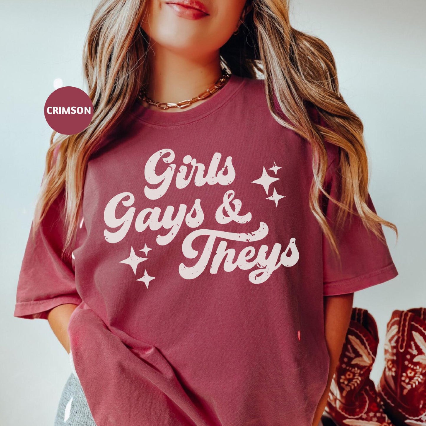 a woman wearing a red shirt that says girls, gays and they