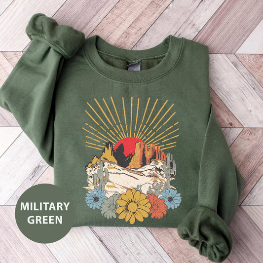 a green sweatshirt with a picture of a bird on it