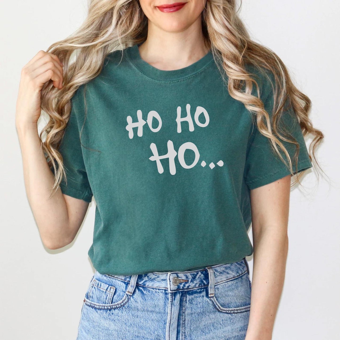 a woman wearing a green shirt that says oh oh