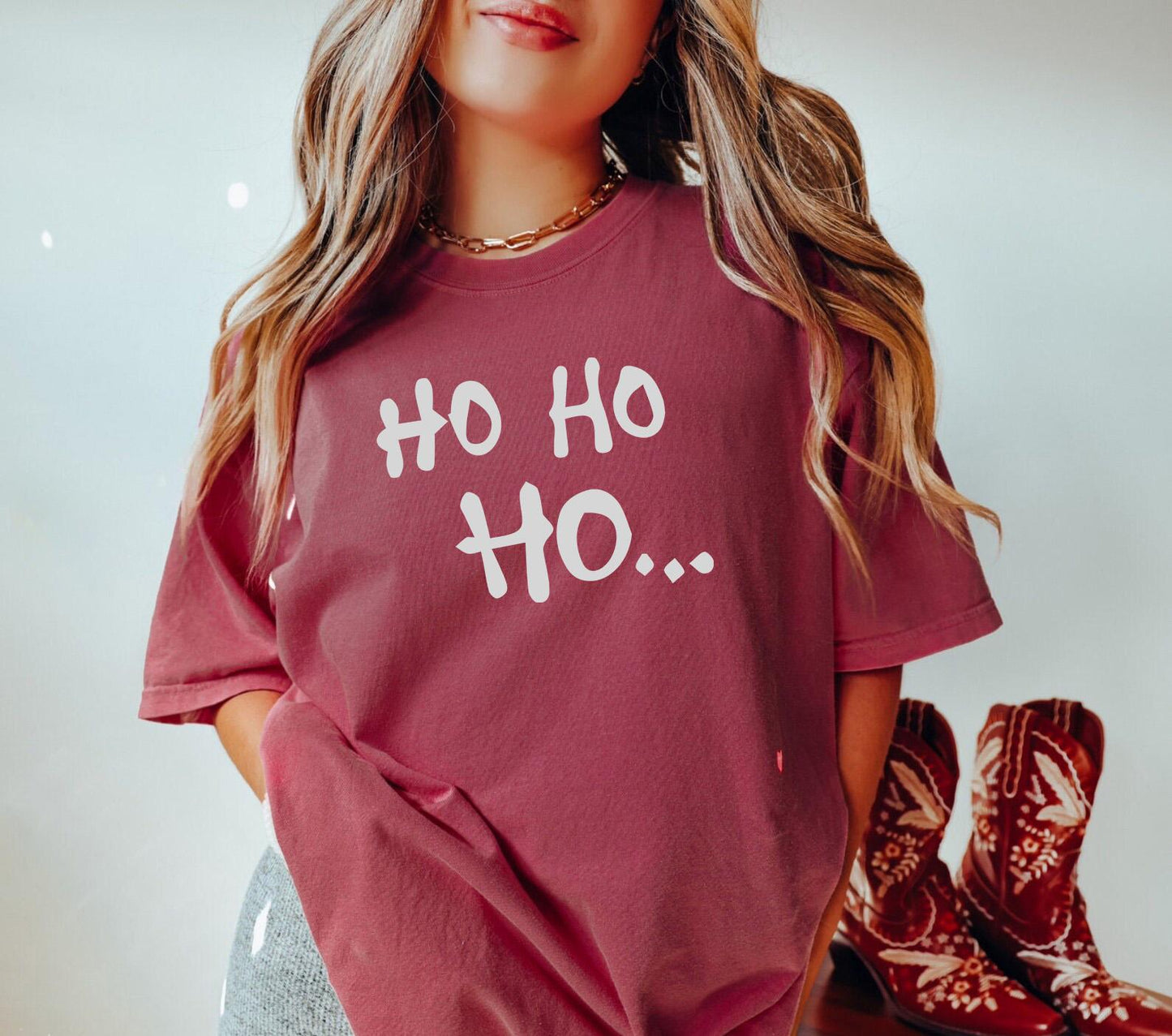 a woman wearing a red shirt with the words oh oh on it