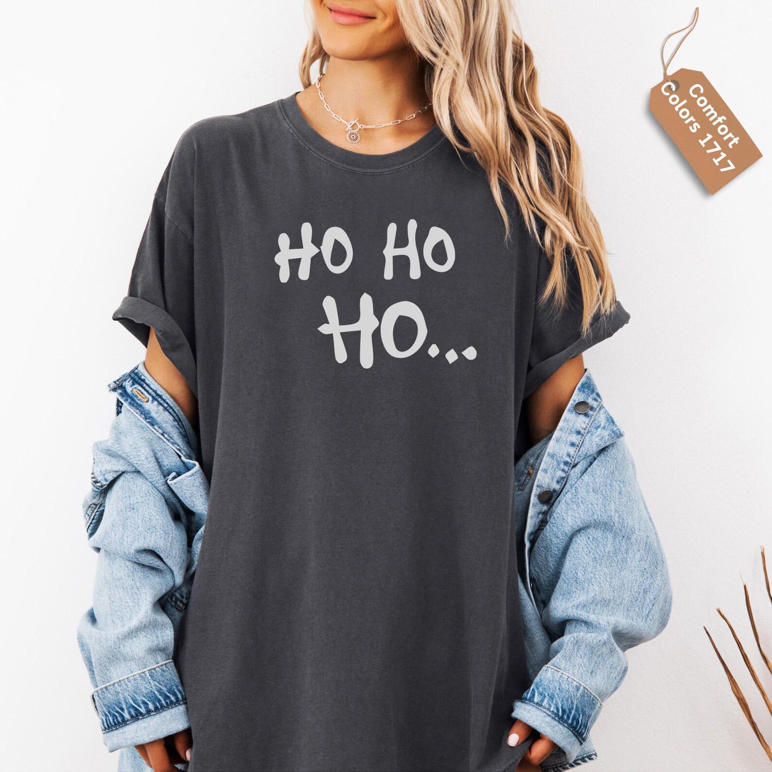 a woman wearing a black shirt with the words oh oh on it