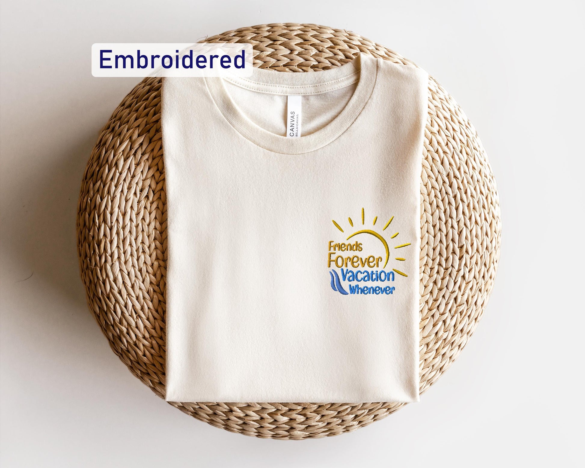 a white t - shirt sitting on top of a wicker basket