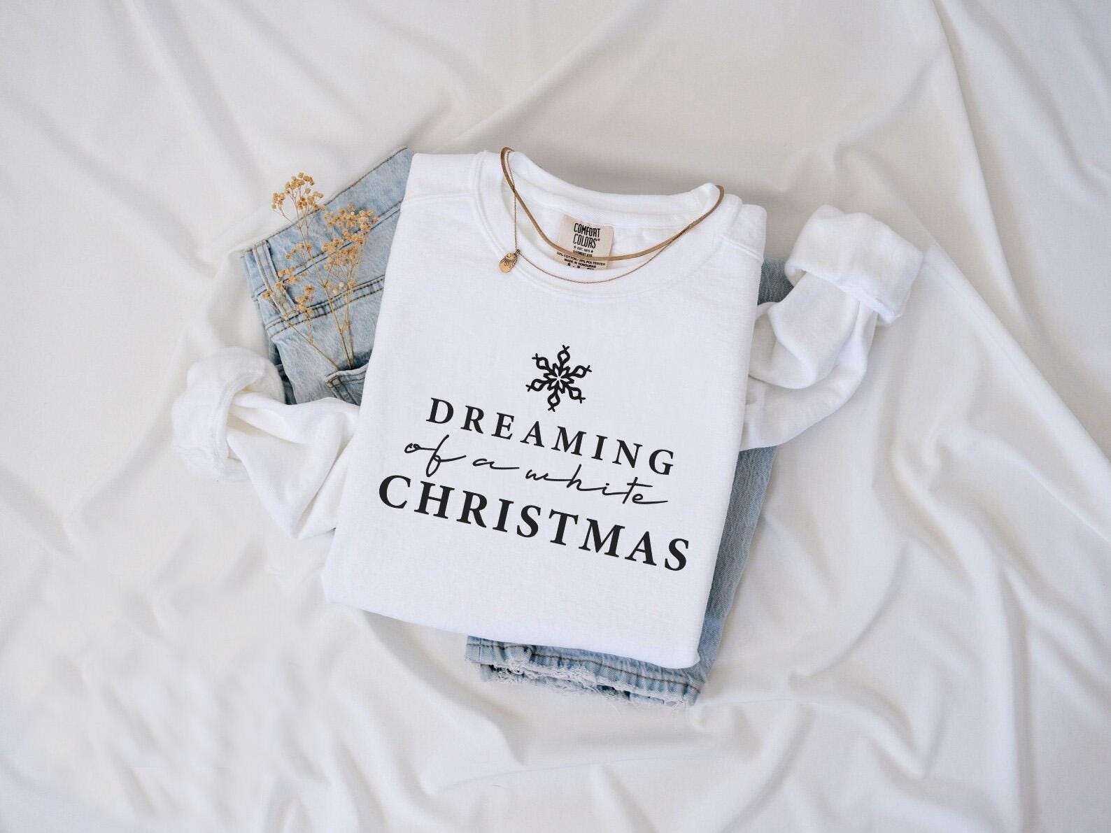 a t - shirt that says dreaming of you and the christmas tree