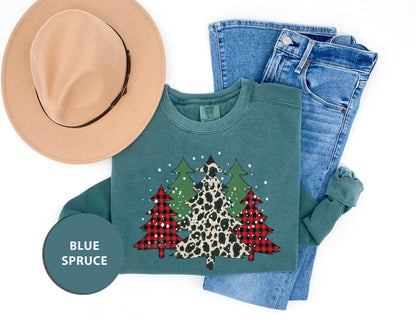 a pair of jeans, a hat and a t - shirt with a christmas tree